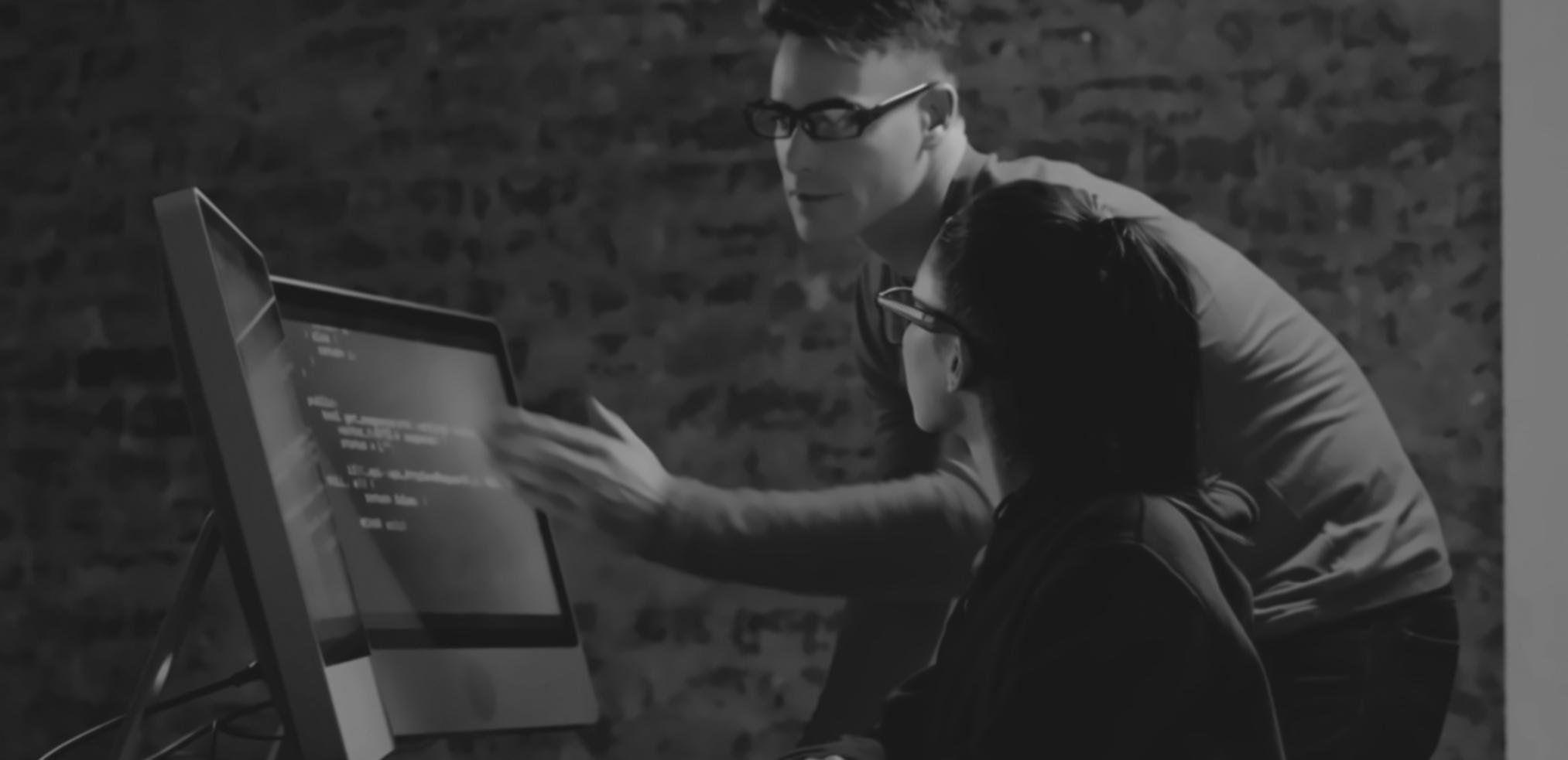 Game development team collaborating on platform game level design and user interface elements